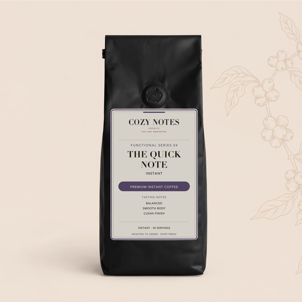 A black bag of Cozy Notes Instant 'The Quick Note' coffee on a light beige background with a subtle coffee plant illustration on the right side.