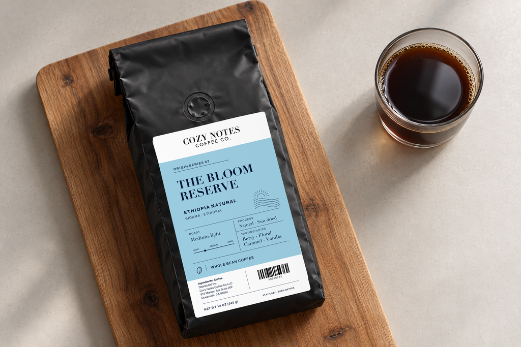 The Bloom Reserve — coffee bag with approved label beside brewed coffee.