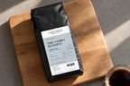 The Cerro Reserve — coffee bag with approved label beside brewed coffee.