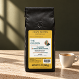 The golden coffee packaging in a café setting
