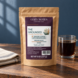 The grounded coffee packaging in a café setting