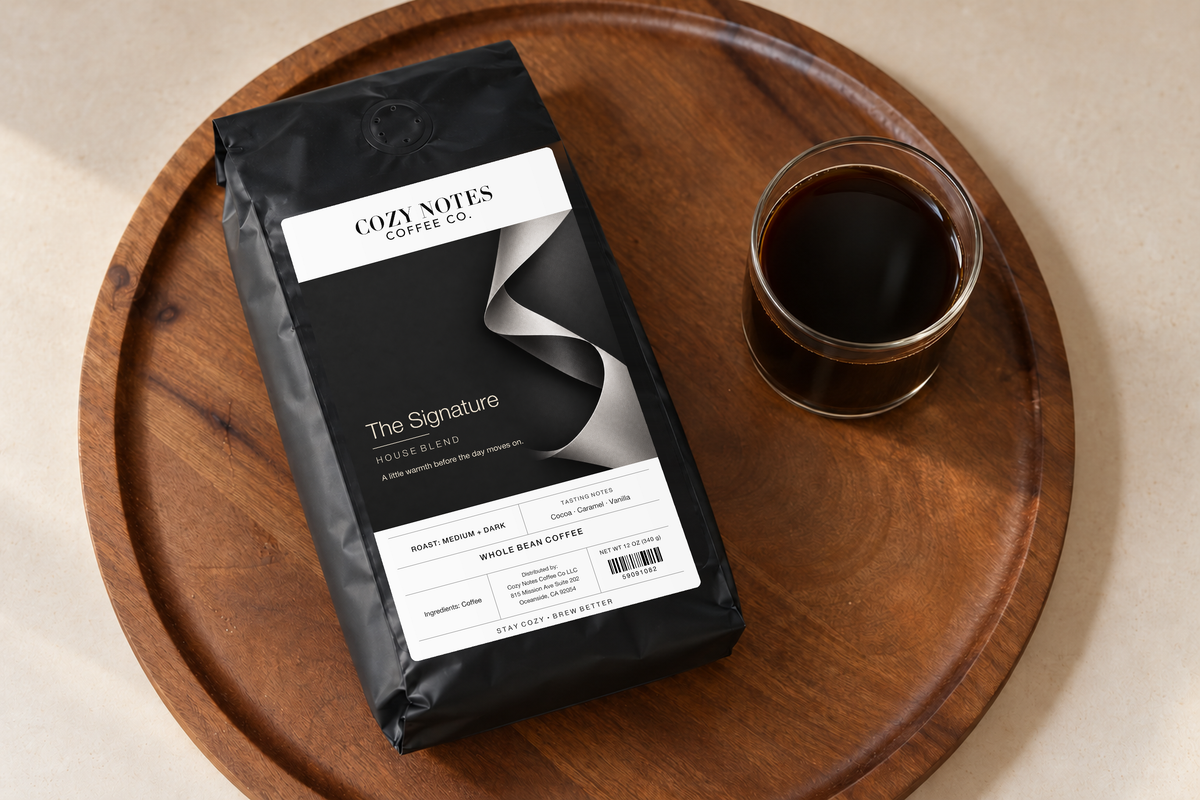The Signature — coffee bag with approved label beside brewed coffee.