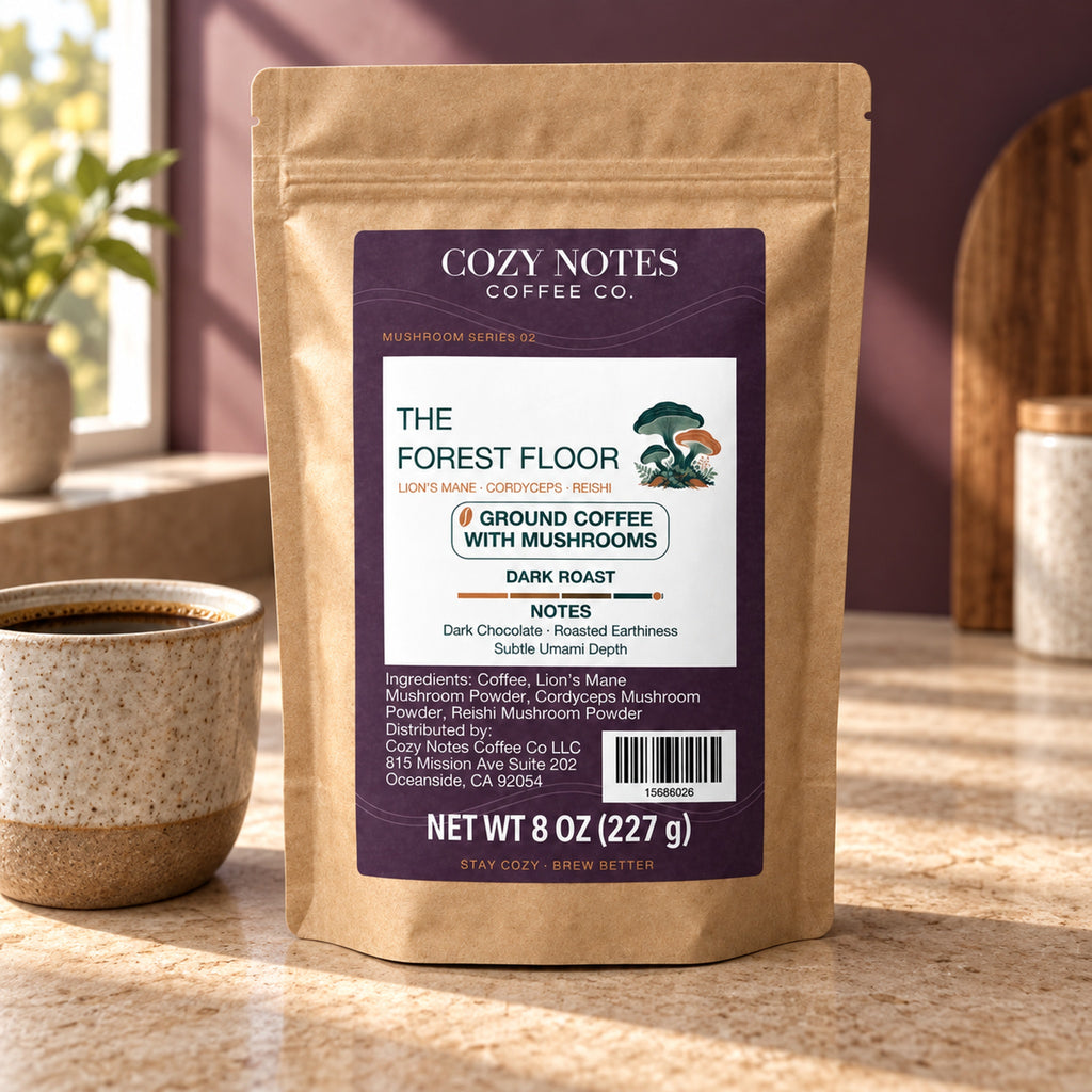 Cozy Notes The Forest Floor dark roast ground coffee with mushrooms, 8 oz (227 g), in a kraft pouch — lifestyle product image.