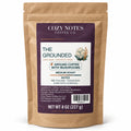 Cozy Notes The Grounded medium roast ground coffee with mushrooms, 8 oz (227 g), in a kraft pouch — main product image.