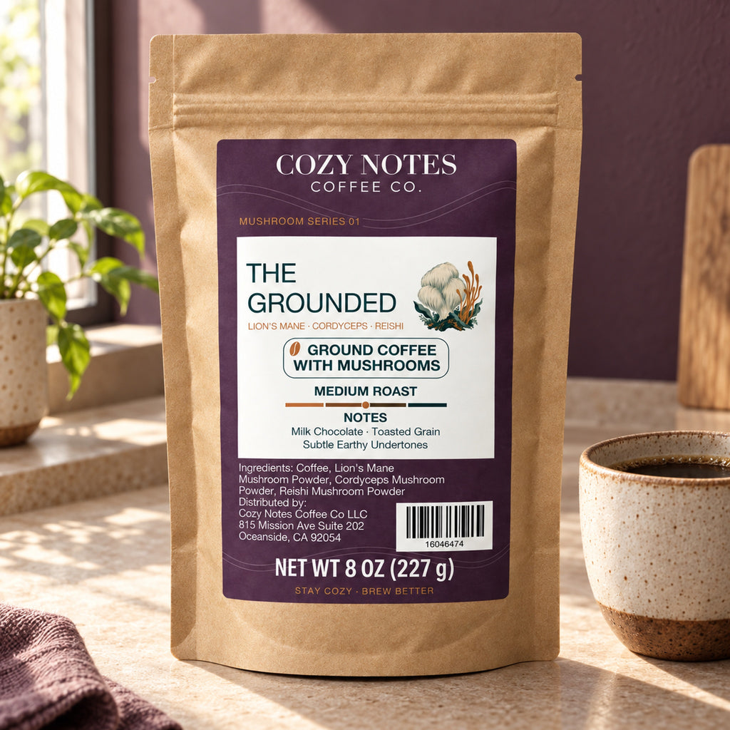 Cozy Notes The Grounded medium roast ground coffee with mushrooms, 8 oz (227 g), in a kraft pouch — lifestyle product image.