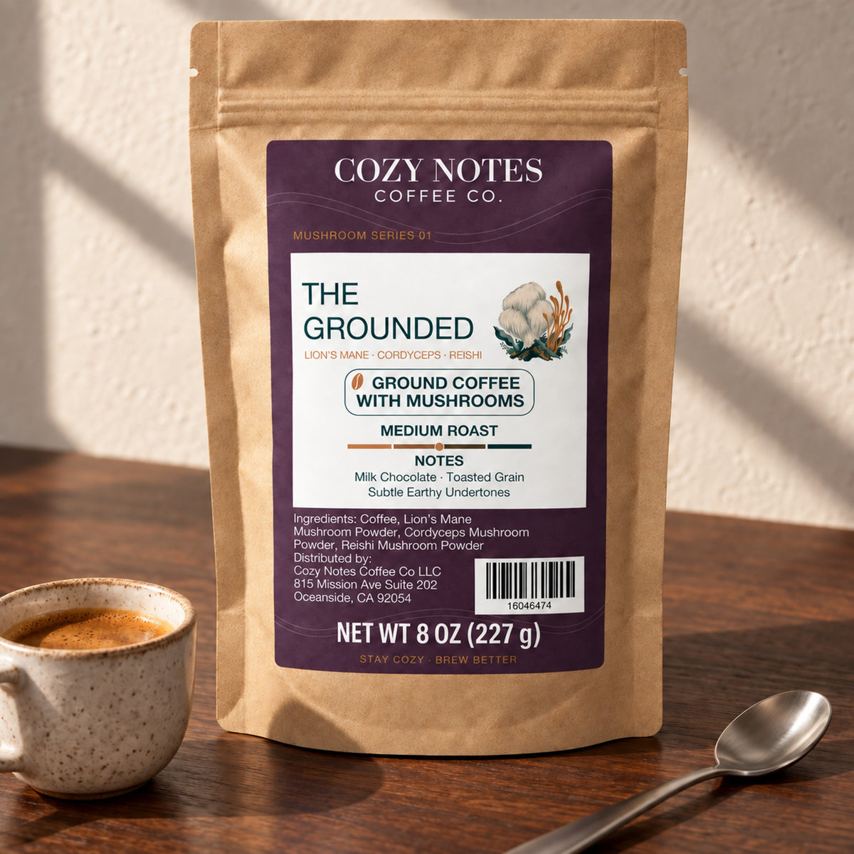 Cozy Notes The Grounded medium roast ground coffee with mushrooms, 8 oz (227 g), in a kraft pouch — editorial product image.