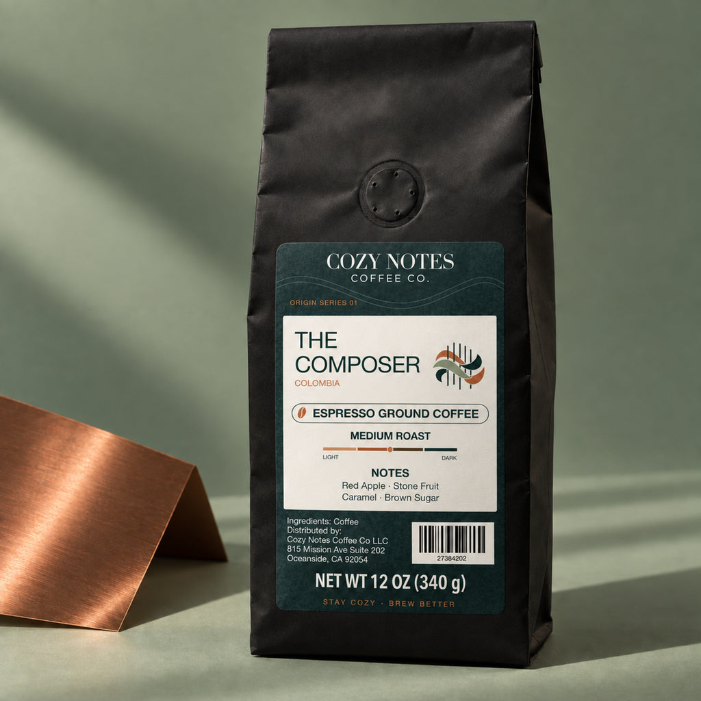 The Composer Colombian coffee, espresso grind, 12 oz, on a sage and copper editorial set.