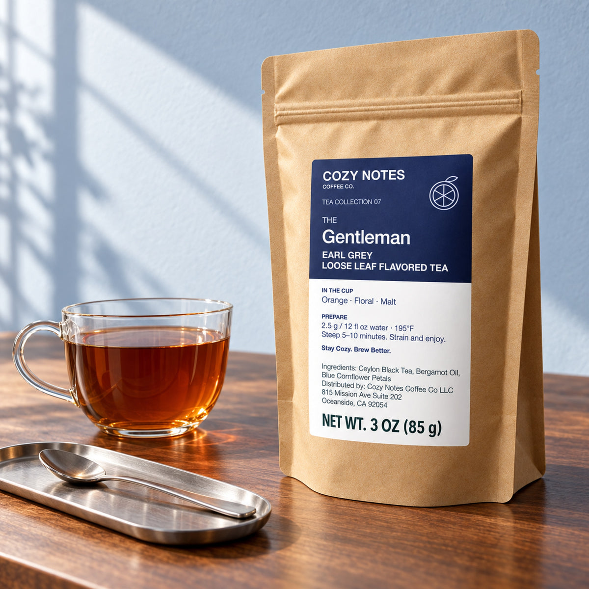 The Gentleman Earl Grey loose leaf tea, 3 oz — premium tea serving scene with the updated Cozy Notes label.