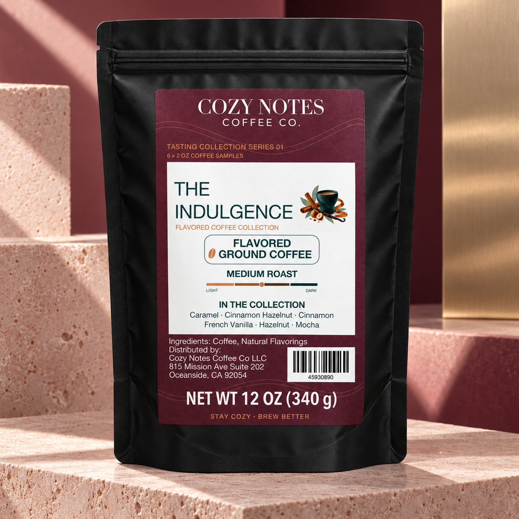 The Indulgence by Cozy Notes Coffee, six 2 oz flavored ground coffee samples in a black stand-up pouch — editorial product photograph
