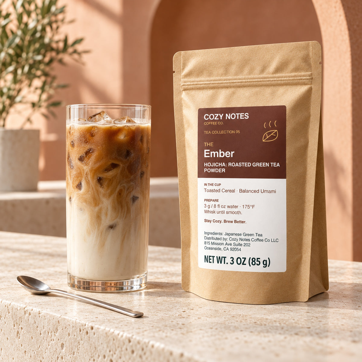 The Ember hojicha roasted green tea powder, 3 oz — premium tea serving scene with the updated Cozy Notes label.