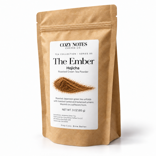 The Ember — hojicha tea, pouch on white background, new Cozy Notes Tea Collection label.