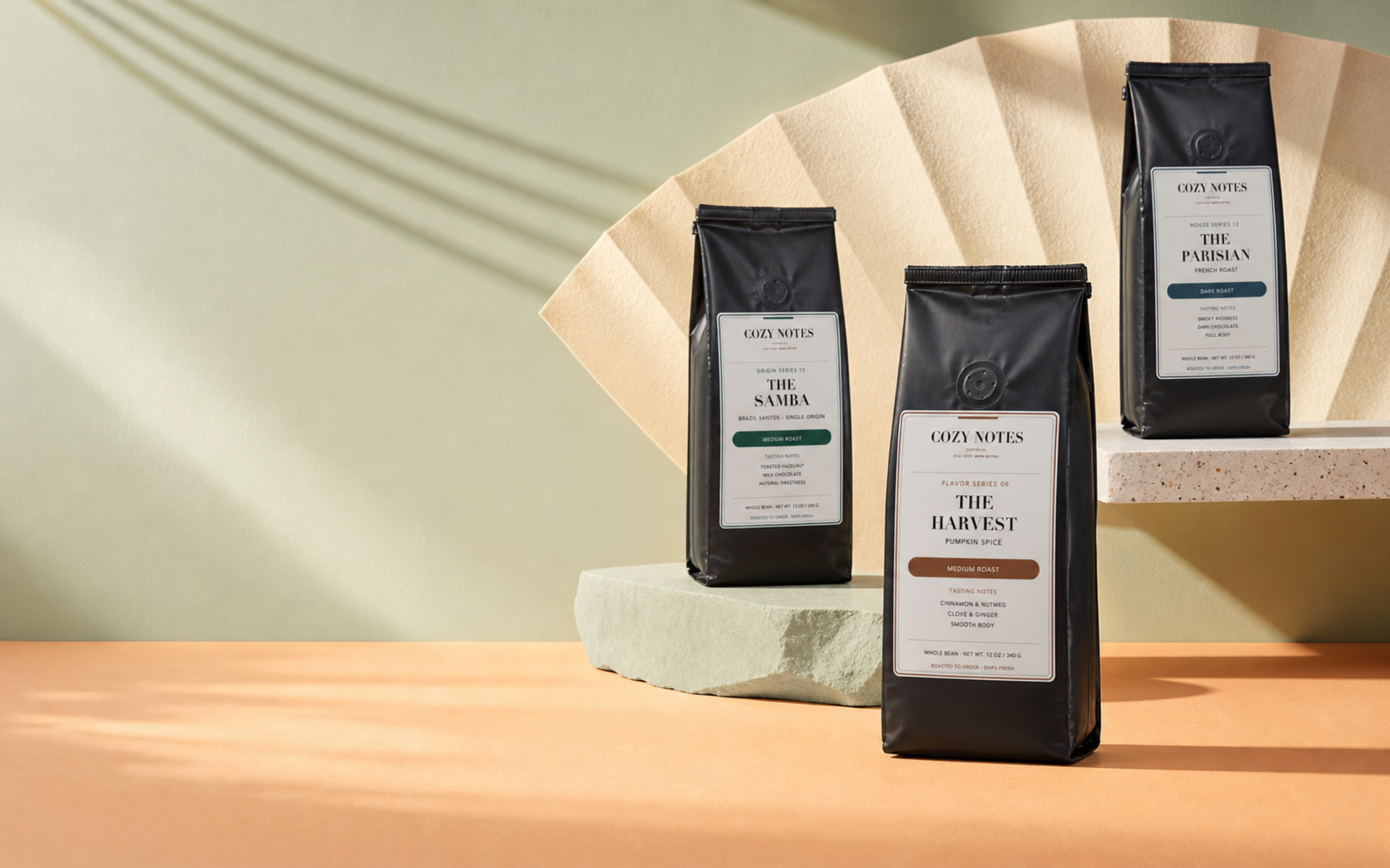Three Cozy Notes Coffee bags with new labels in the original Morning Notes celadon and apricot campaign
