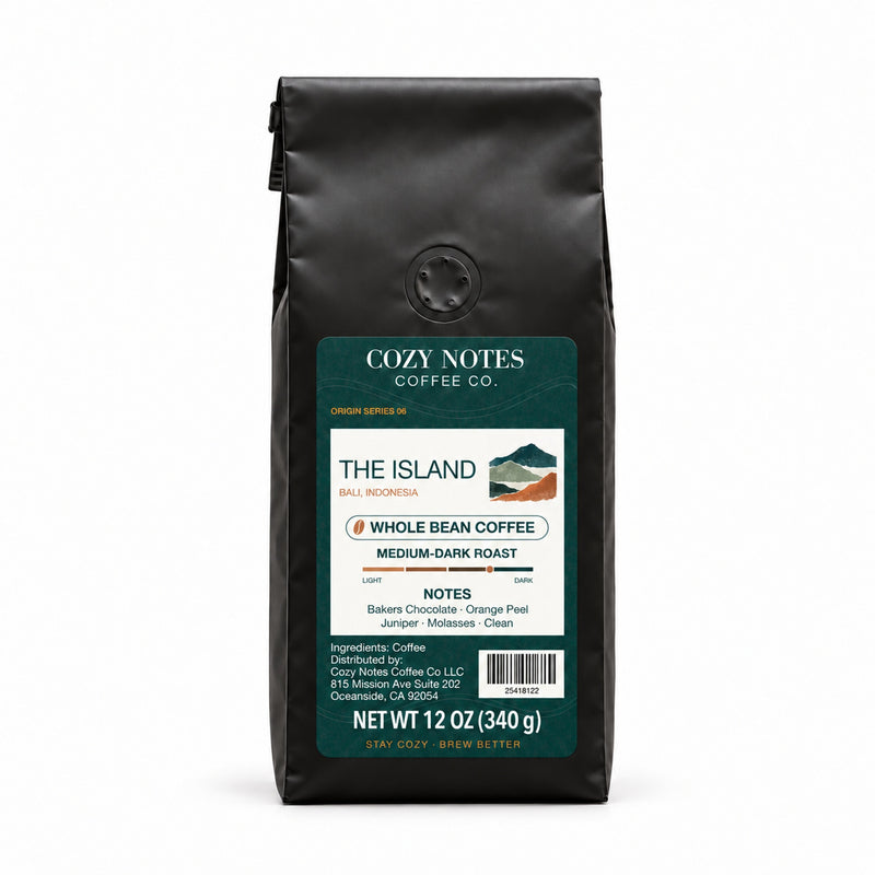 The Island Bali medium-dark roast coffee, whole bean, 12 oz — main view with Cozy Notes mountain label.