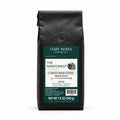 The Rainforest Papua New Guinea medium roast whole bean coffee, 12 oz — main photograph.