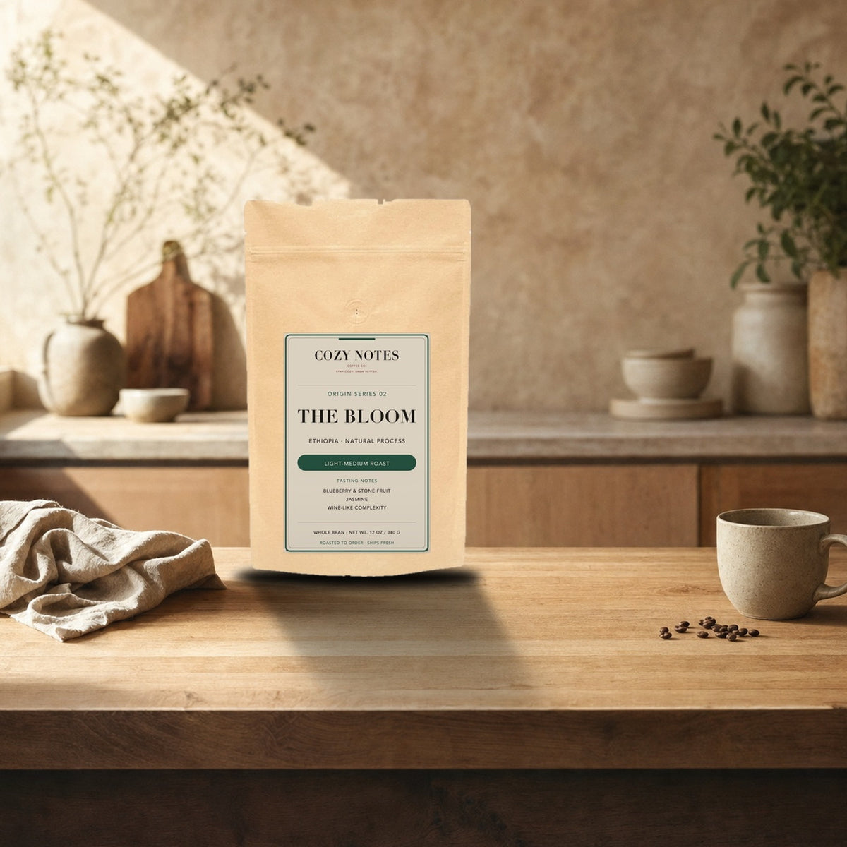 The Bloom — Ethiopia Natural Single Origin Coffee, Light-Medium Roast — 12 oz Cozy Notes bag on a kitchen counter, roasted to order