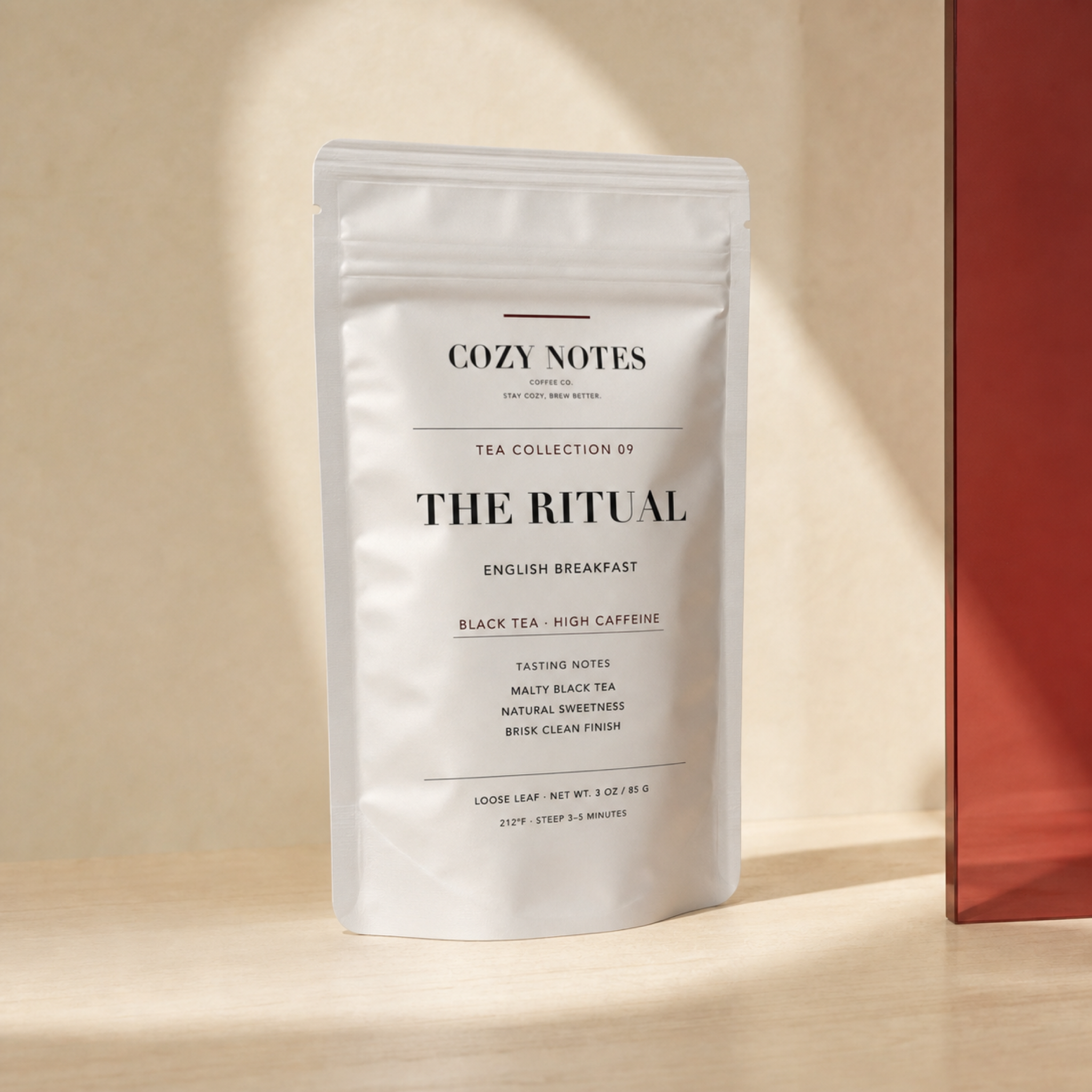 Cozy Notes The Ritual English breakfast tea pouch in a butter and oxblood editorial setting